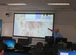 Instructor demonstrating a map to students