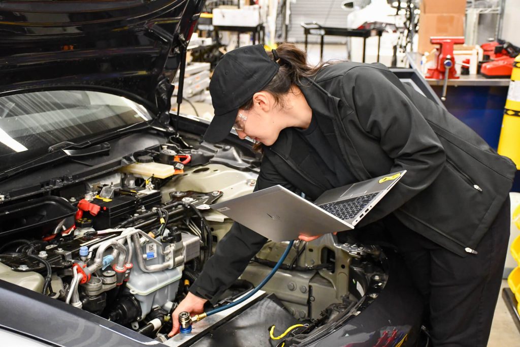 A female student in the auto tech lab