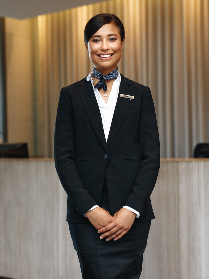 A young woman working as a hotel receptionist