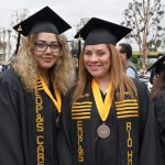 Two newly minted Río Hondo College graduates (mother and daughter) proudly wear Extended Opportunity Programs and Services (EOP&S)/Cooperative Agencies for Resources for Education (CARE) sashes, marking the end of their academic journeys at the College.