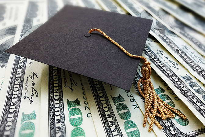 Mini graduation mortar board cap on money