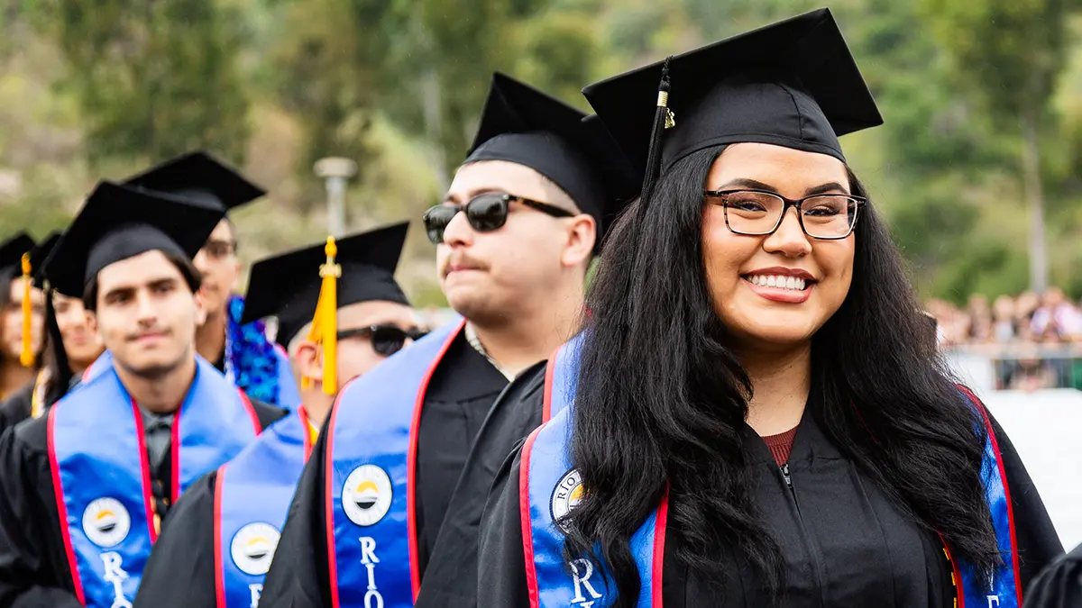 graduating students smiling