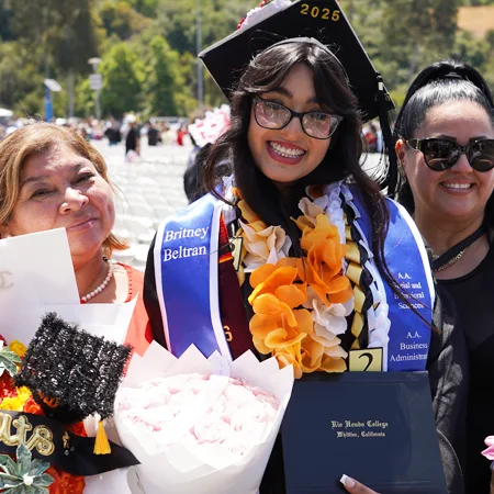 graduate with family