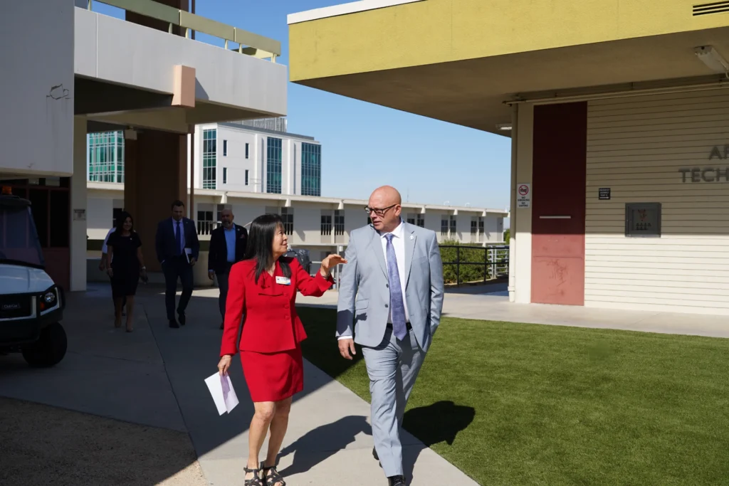 Río Hondo College Superintendent/President Teresa Dreyfuss talks to Director of Workforce Initiatives Troy Selberg as they walk to the CWE department.