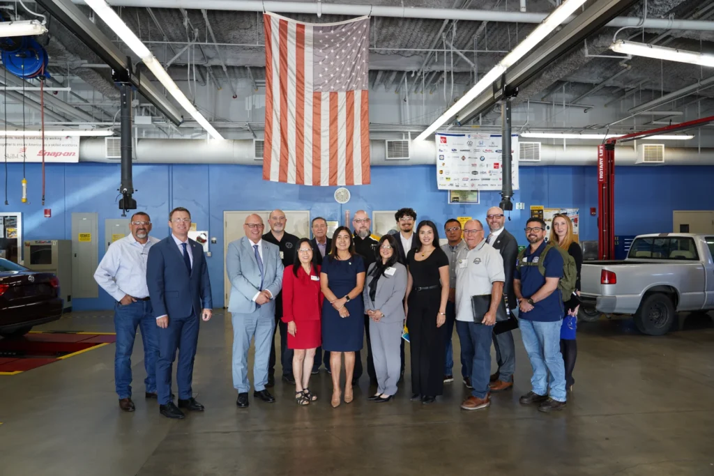 Río Hondo Community College District Board of Trustees, Superintendent/President Teresa Dreyfuss, Board of Trustee President Lomeli, Vice President Rocha, Board member Valladares, and senior administrators along with Director of Workforce Initiatives Troy Selberg and Western Regional Representative Joshua Wetzel, and CWE administrators, faculty, staff and partners pose for a group picture.