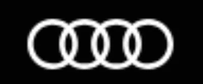 Four interlocking white rings form the Audi logo against a black background.