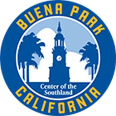 Circular logo for Buena Park, California, featuring a clock tower, palm trees, and the text “Center of the Southland” in white and yellow on a blue background.
