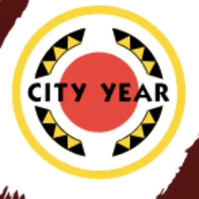 City Year logo with a red circle in the center, yellow and black triangles forming a partial ring, and the words “CITY YEAR” in bold letters across the middle.